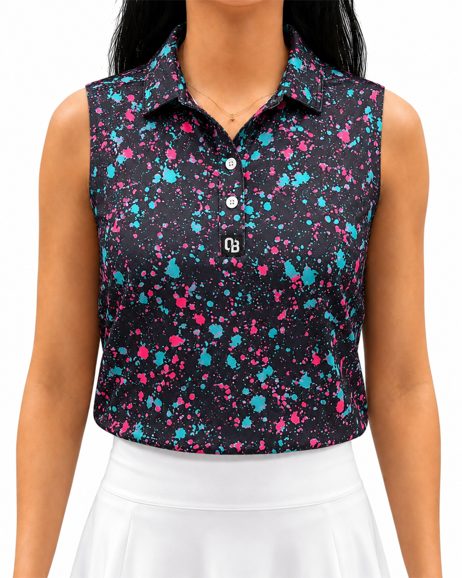 Paint Splatter women’s sleeveless golf polo with pink and turquoise splatter print