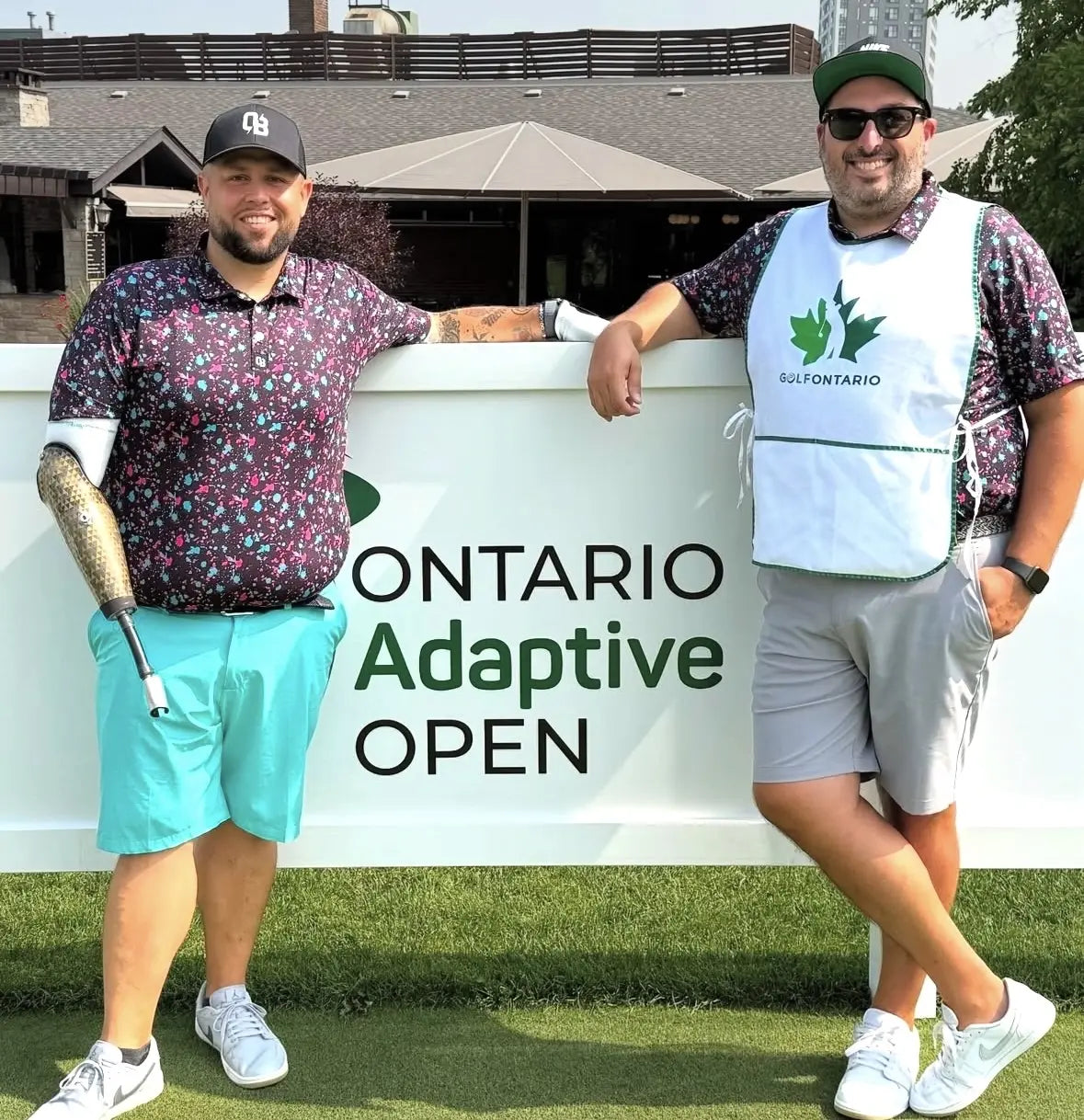 Two golfers wearing Shop Out of Bounds apparel at an inclusive golf event in Ontario