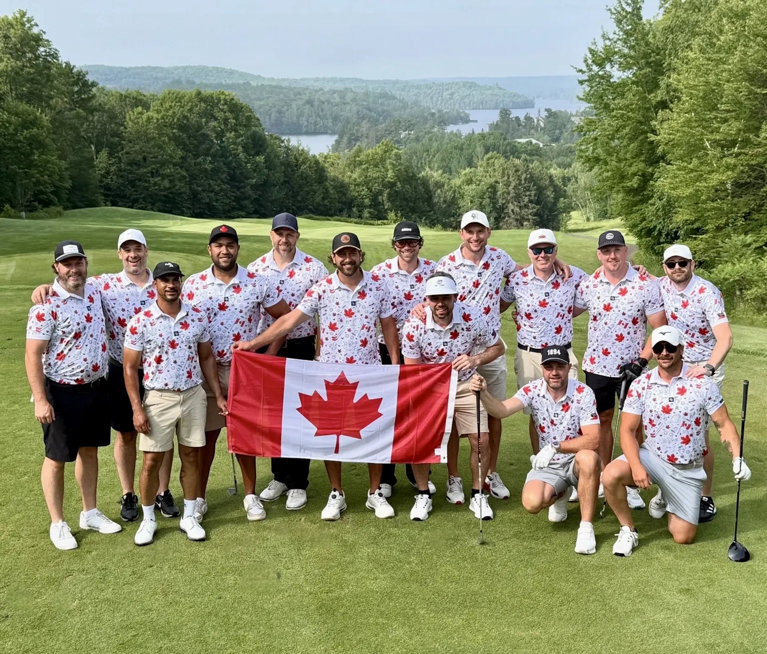 Large tournament group wearing matching Canadian Shop Out of Bounds polos and holding a Canadian flag